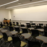 A view of the front of the classroom showing the podium and whiteboard.