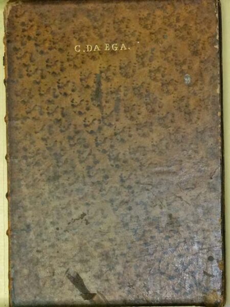 Old brown book cover with gold stamped letters at the top: 'C. DA EGA.'