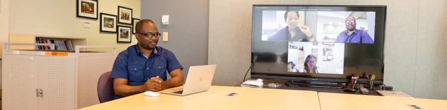 a banner photo of jmu libraries employees and jmu faculty members collaborating on zoom and in rose library
