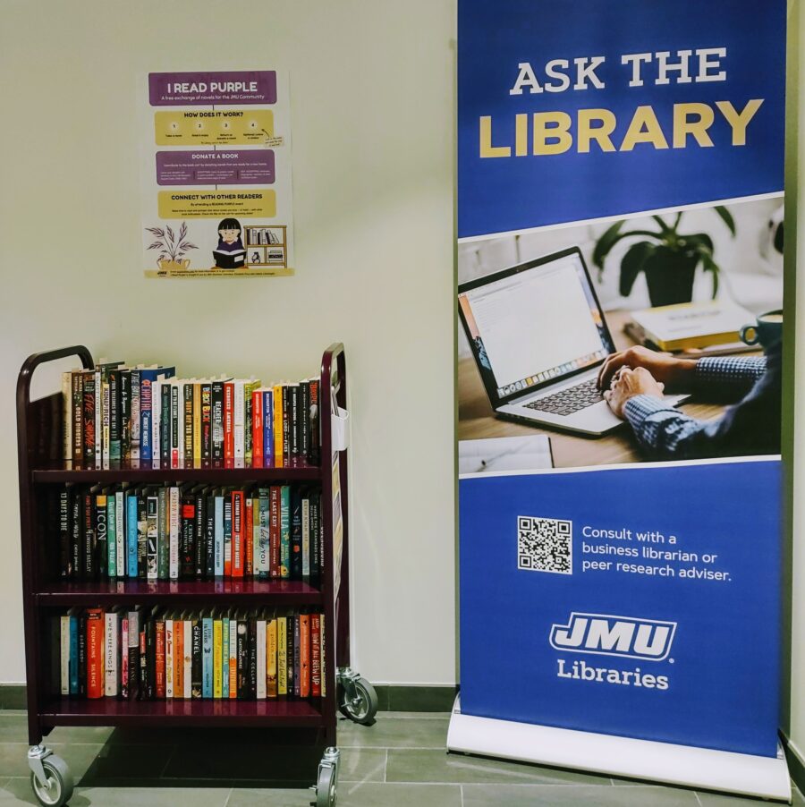 Photo of the Read Purple book cart and related signage