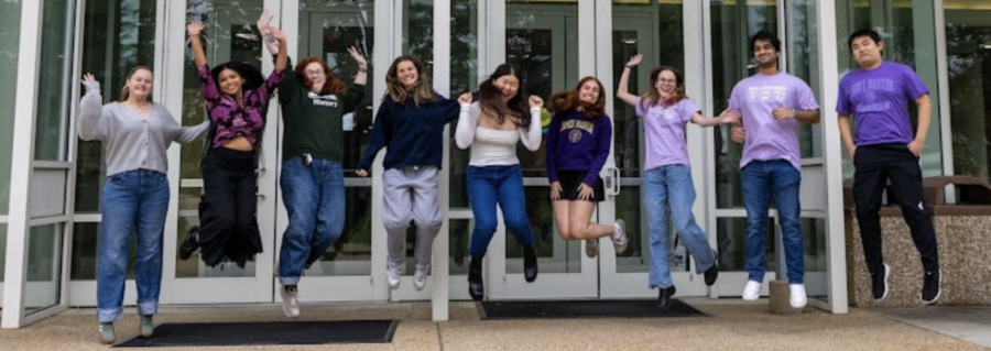 students jumping in front of rose library, happy that their textbooks are affordable