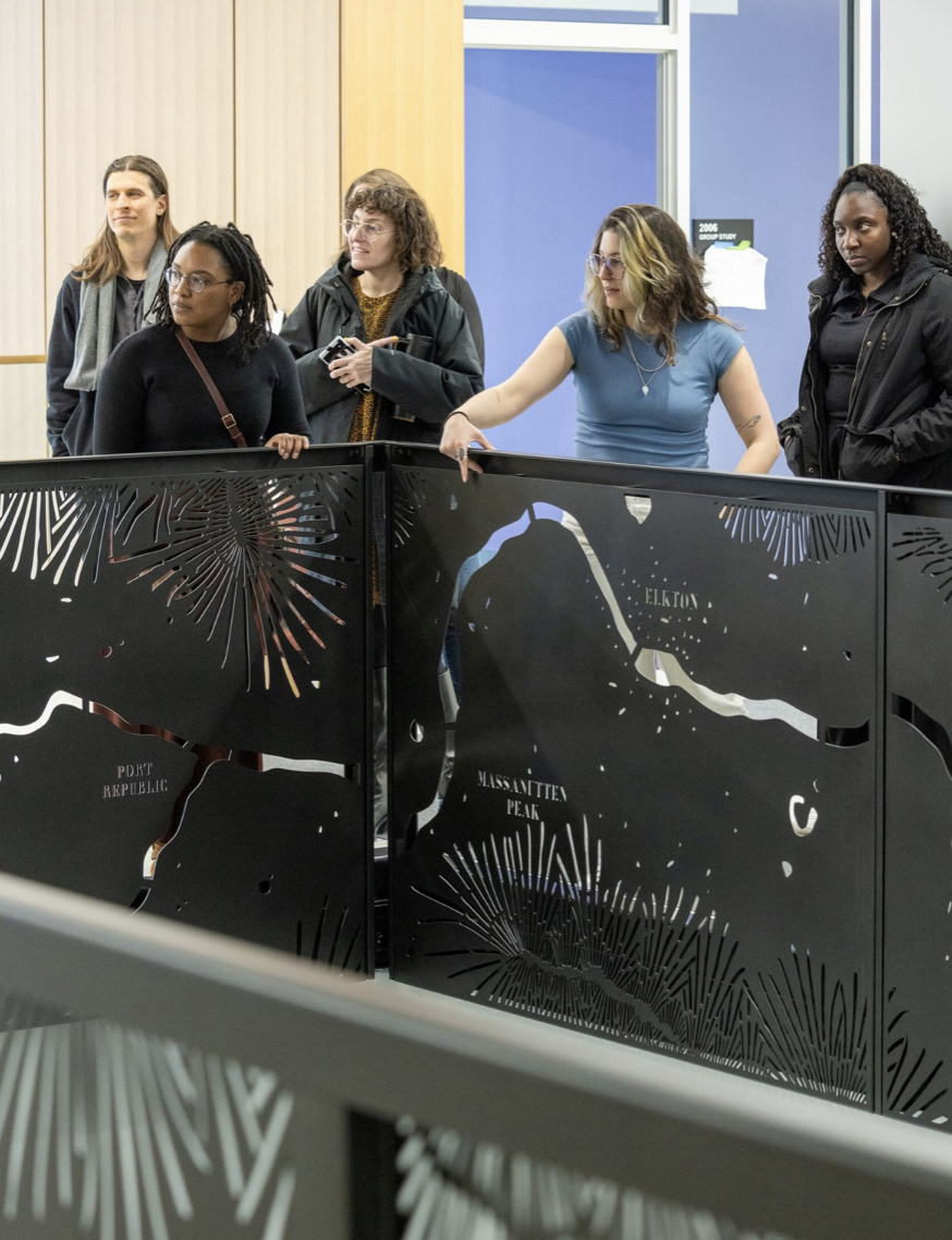 people looking at the staircase