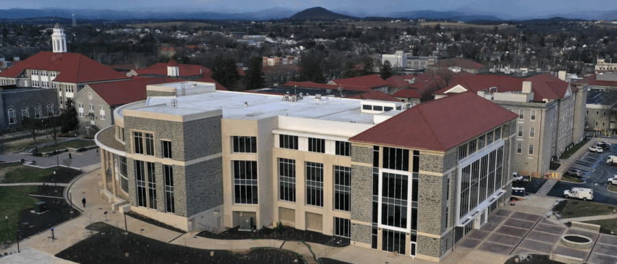 aerial photo of the jones wing of carrier library, with campus, mole hill, and other mountains in the background