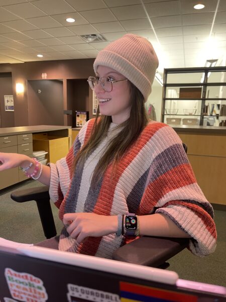 photo of Summer behind library desk