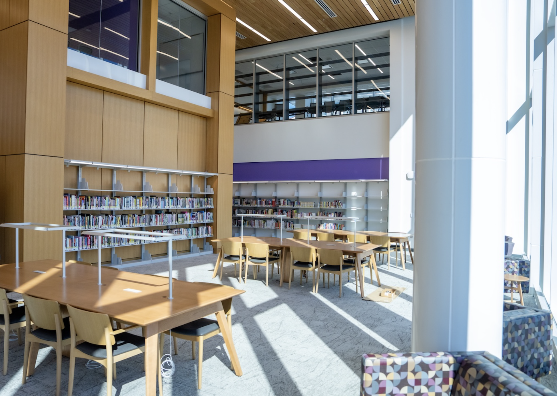 the double-height open study space in carrier that features popular books and graphic novels
