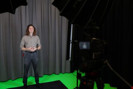 a jmu libraries team member records video in one of the new Audio/Video Studios in Carrier Library