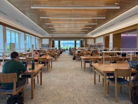 Large room with many study tables.