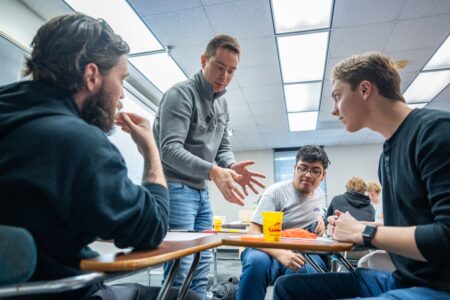 a faculty member talks to students in a classroom at jmu
