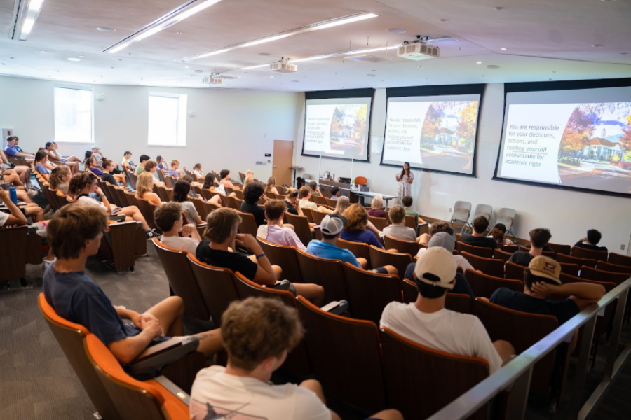 large classroom with 3 projector screens
