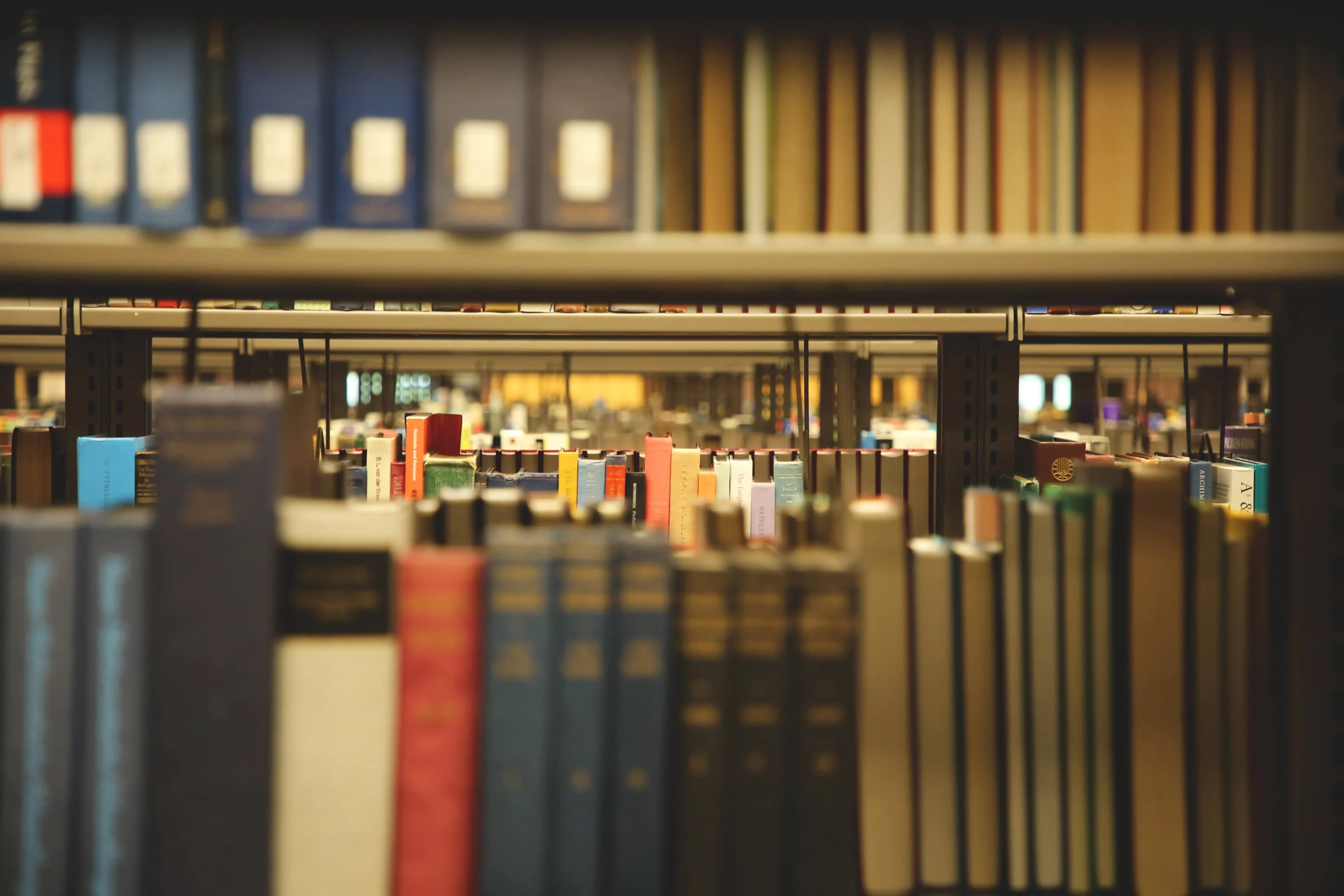 Peering through stacks of books in Rose Library.